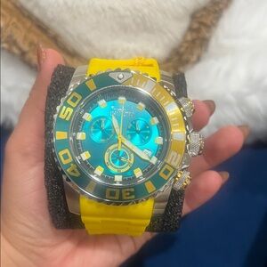 Invicta Blue Dial Watch with Yellow Strap and Green Bezel